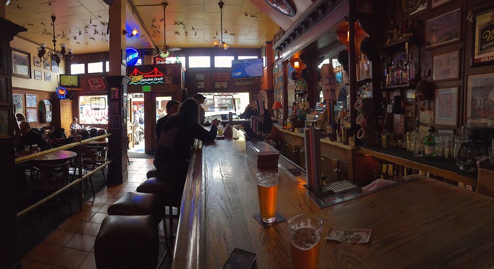 The long wooden bar at Nave's
